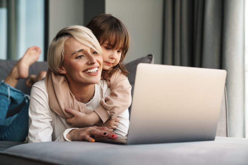 A parent and daughter booking a class together on a phone
